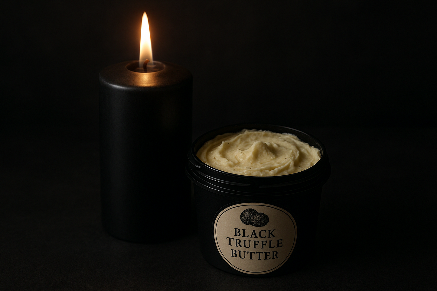 Black candle in front of Black truffle butter